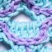 A close up of a scale on the light blue scarf option.